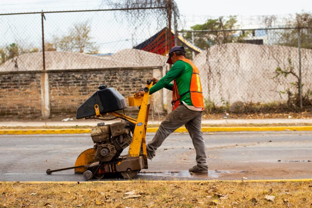 Concrete flat saw cutting a slab